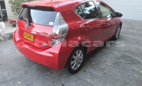 Buy Import Toyota Prius c Red Car in Import - Dubai in Central