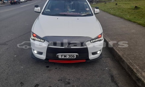 Buy Used Mitsubishi Lancer White Car in Komave in Western